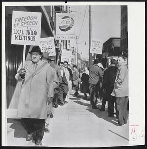 Threat of disciplinary action against a union member brought out 40 members of the Textile Workers Union of America. They picketed the office of area director Denis Blais in Lewiston, Me. The union member was accused of action detrimental to TWUA.