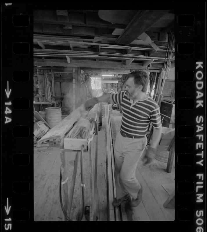 Man working in Pert Lowell's boat shop