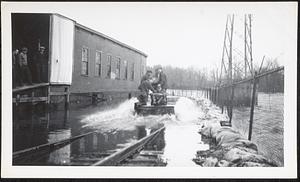 Pepperell Paper Mill flood damage with trestle and flooded railroad tracks