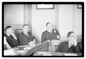 Group of men at table