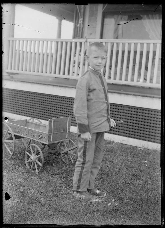 Wagon w/ small boy (in uniform)