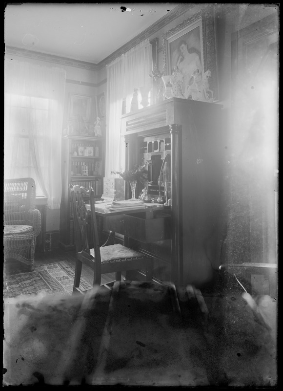 Interior - portrait of woman & desk, wicker chair