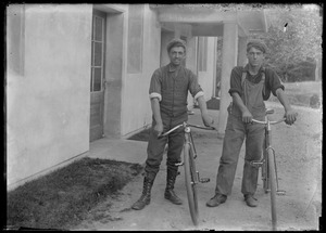 2 young men, bicycles