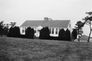 The two-room school was moved from the village center to the hilltop facing the new Highway 28, at a cost of $27,000. The Marstons Mills Elementary School was enlarged at the back to four rooms, with a basement for a kitchen, toilets, and cafeteria with a stage for plays and graduation ceremonies