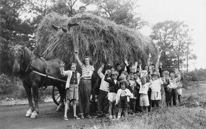 Alfred Fuller giving a hayride to the campers at Fair Acres