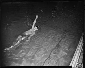 SC Swimmer swimming backstroke