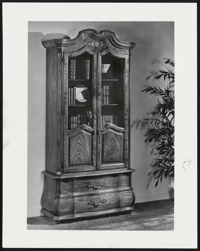 Elegant Armoire from Thomasville's Collector's Gallery line features bombe base, graceful lines and elegant wood and wire display doors. Available in walnut veneers and pecan solids.