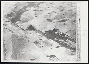 Iceboxed-- Tug pulls naval vessel through blocks of ice that choke Hudson River near Ossining, N.Y.