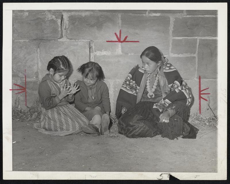 No Room at School -- Amy year-old Navajo child looks on enviously as Elizabeth James and Mary recess of their school at Chin Lee, Ariz. Amy was rejected at the was no room for her and many other of the Navajos.