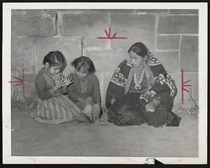 No Room at School -- Amy year-old Navajo child looks on enviously as Elizabeth James and Mary recess of their school at Chin Lee, Ariz. Amy was rejected at the was no room for her and many other of the Navajos.