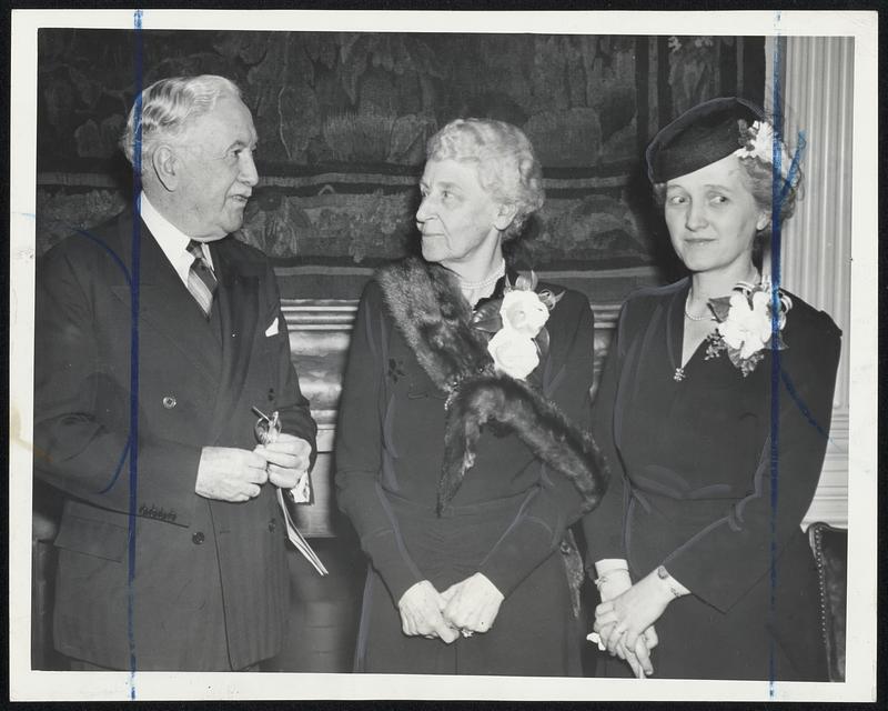 Travelers Aid Society work was reviewed yesterday at the annual meeting at the home of Mrs. Charles Francis Adams, center, at which P.A. O’Connell, left, Boston merchant, was re-elected first vice-president and Mrs. Emily B. Houghton, right, was re-named executive secretary.