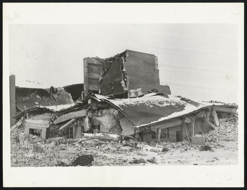 Shattered by the new earthquake of Oct. 31, the Helena, Mont., high school is shown here as it appeared after the earth tremors had ceased.