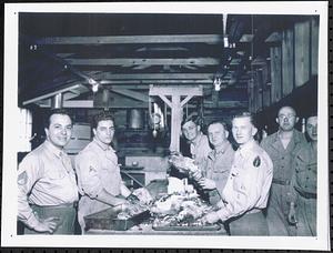 Wesley Dickinson with fellow soldiers in the mess kitchen