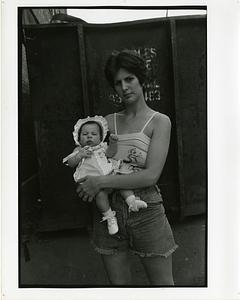 Portrait of a woman holding a baby