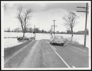 Flood Waters halt traffic on Rte. 47 in Hadley during peak of flood crest today. Waters were reported subsiding this afternoon.
