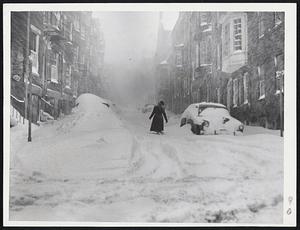 Valiant Lady On Beacon Hill - At the height of the storm this lady took her lonely way through the mounting drifts on Pinckney street while strong men stayed inside.