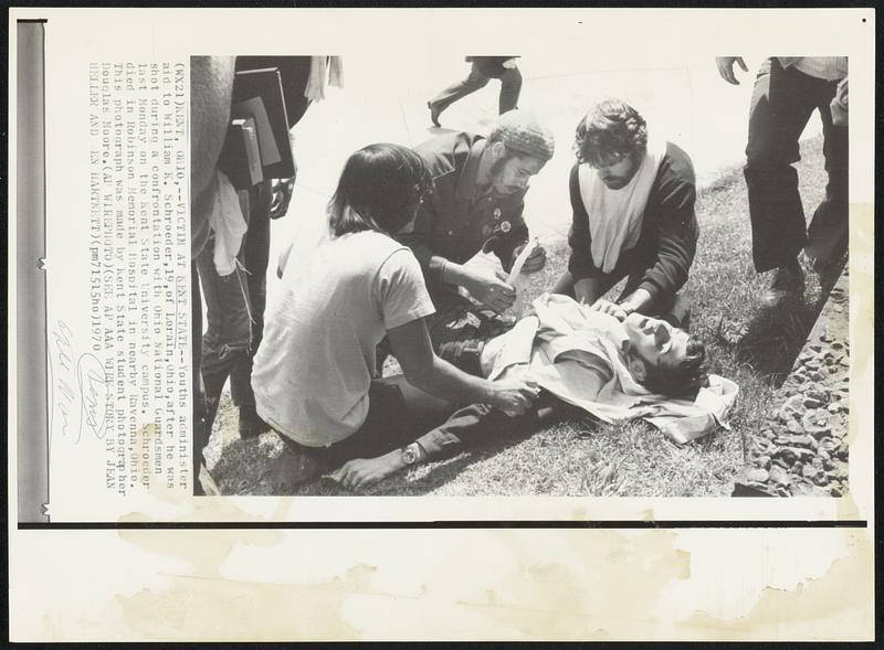 Youths administer aid to William K. Schroeder,19,of Lorain,Ohio,after he was shot during a confrontation with Ohio National Guardsmen last Monday on the Kent State University campus. Schroeder died in Robinson Memorial Hospital in nearby Ravenna,Ohio. This photograph was made by Kent State student photographer Douglas Moore.