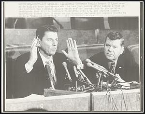 California Governor Ronald Reagan (L), gestures as he tells a news conference what he just seeing after making a tour of the northern San Fernando Valley which was the hardest hit by the massive earthquake that hit the Southern California area 2/9. Los Angeles County Supervisor Warren Dorn listens as the Governor declared Los Angeles County to be in a "State Of Emergency)."