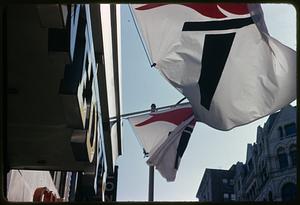 Flags hanging above a sign