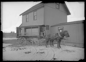 Man (Charles W. Parker?) driving horse-drawn carriage