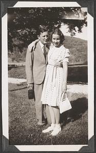 An unidentified man and woman holding each other