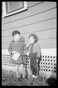 Two children posing outside