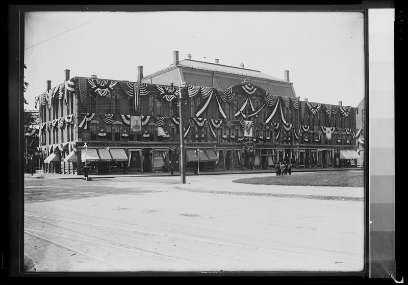 Clark’s block with bunting, corner of Main St. and West Central St.