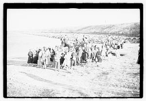 A group of young women walking by the water