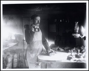 Jack Hickey at work in his old shop. -Border St.