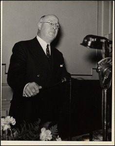 James A. Farley speaking over radio at luncheon giving to him by the Harvard Stamp Club at the Hotel Commander, Cambridge