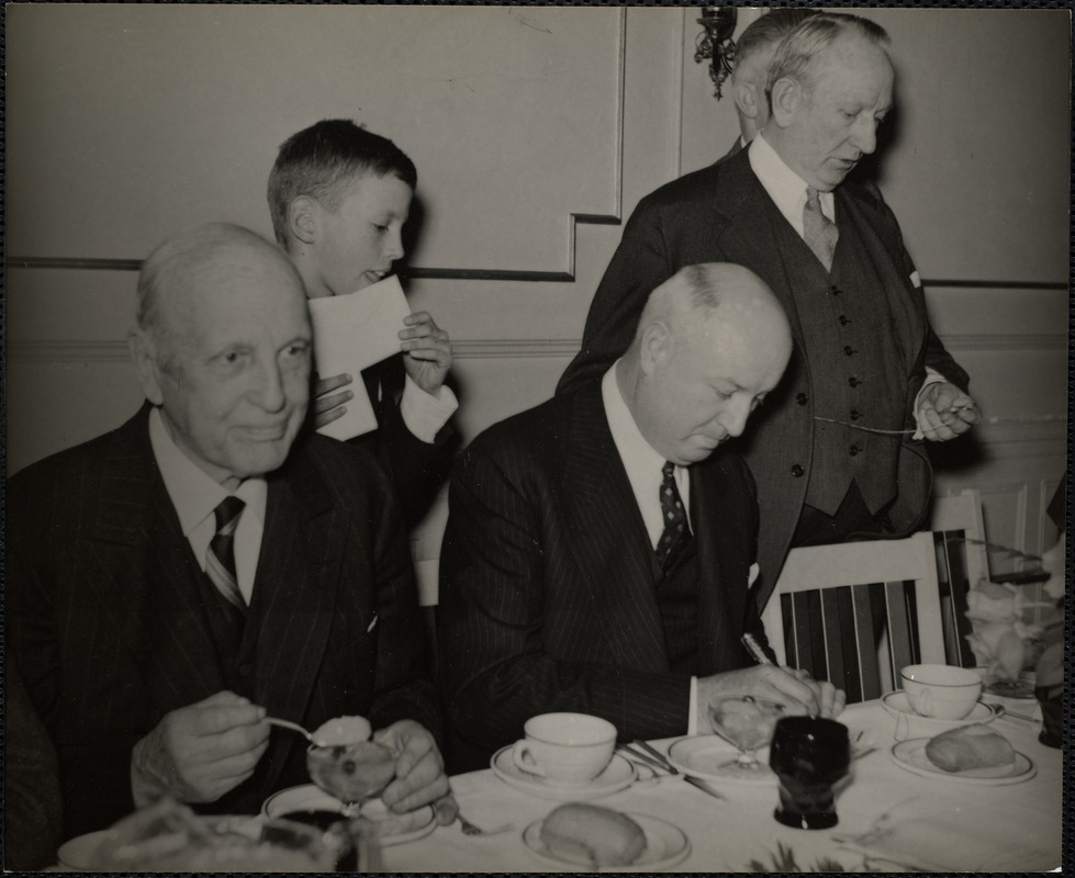 L to r. Rev. Samuel A. Eliot, Charles W. Eliot, 3d, James A. Farley autographing some first day covers for young Eliot & Boston's Post Master Peter Tague