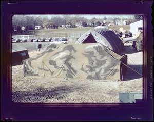 Cemel- camouflage tent, at some kind of base