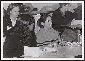 Young people sitting and eating