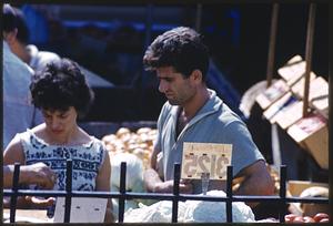 Woman and man shopping at outdoor market, Boston