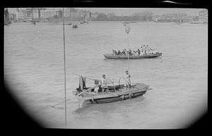 Waiting to disembark in Shangai, beggars with long pole nets