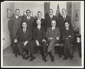 Major League Baseball Owners and Managers Convene. Major League baseball club owners, assembled in New York, December 8, with managers, players and camp followers for the annual winter conventions. Photo shows managers of the American League clubs with their president, Ernest S. Bernard. Left to right; seated: Joe McCarthy, New York; Connie Mack, Philadelphia, PA.; Barnard; Stanley Harris, Detroit, Mich. Rear: Eddie Collins, Philadelphia, PA., Coach; Roger Peckinpaugh, Cleveland, Ohio; Donnie Bush, Chicago, ILL; William Killifer, St. Louis, MO., and John Collins, Boston, MASS.