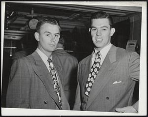 Hoping to Sink Those smiling molars into the Red Sox is Art Houtteman (right), who will be the starting pitcher for the Detroit Tigers at Fenway Park tonight. Checking into Hotel Kenmore with Houtteman is Pitcher Ted Gray.