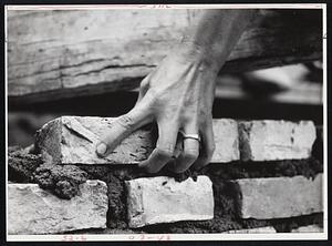 Hand laying bricks