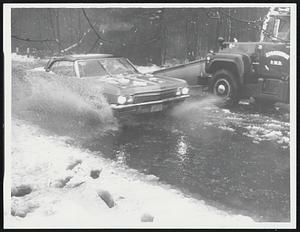 Practically Sailing on Route 139, Stoughton, yesterday was this car. On the right, a town Public Works truck clears away snow banks.
