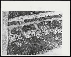 Mount Clemens, Mich. - Tornado Damage Viewed From The Air - Airview of houses which were turned into kindling wood when a tornado smashed into a housing area near the Selfridge Air Force today. Heavy destruction was reported in an area about two miles long and three quarters of a mile wide.