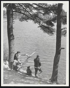 Watchful Waiting for the strike of the first trout of season is practiced by this mixed group of anglers on opening day of the Massachusetts season in what must have been the only peaceful corner of Walden Pond in Concord where thousands of anglers were on hand long before daylight yesterday.