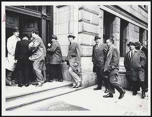 Nine Carmen enter Suffolk Superior Court today to answer contempt citations before Judge Lewis Goldberg. Third from left with papers under his arm is counsel for the men, Boston Atty. Arthur J. Flamm.