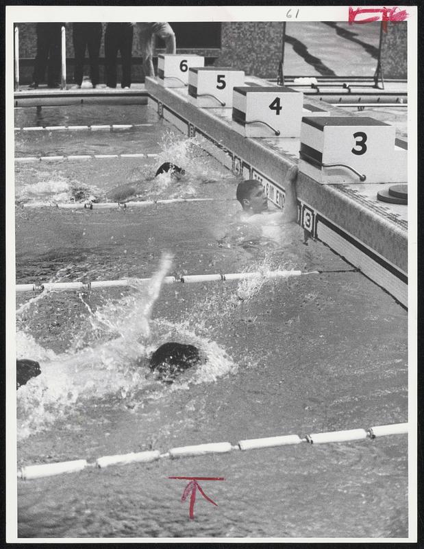 Safely Home - Olympian Don Schollander of Yale's freshman swimming team, in lane 3, relaxes after record-breaking victory over Harvard in 500-yard freestyle. Schollander's time was 4:57.2.