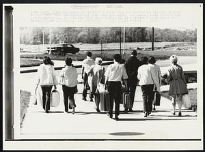 Students Evacuate Campus--Among the last of the students at Kent is this group that left dormitories late Tuesday morning. The campus, scene of shootings and demonstrations, that claimed four lives Monday, has been ordered vacated, except for National Guard and police.