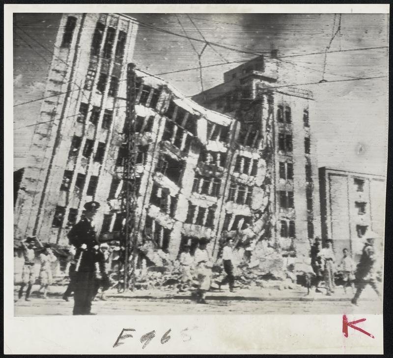 Wrecked By Jap Quake -- The seven-story Daiwa department store in Fukui, Japan, leans dangerously after recent earthquake rocked the area and fire broke out in the city. The building is the city's largest.