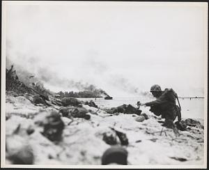 Marines of the First Division burrow deep in the sandy beach of Peleliu as they invaded the Palau Islands group