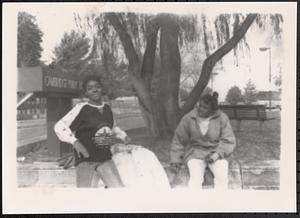 Cheryl and Tawana by the Cambridge Public Library sign