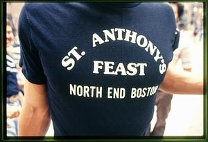Boston: A man wears a St. Anthony's Feast T shirt during the St. Anthony's Feast 2002