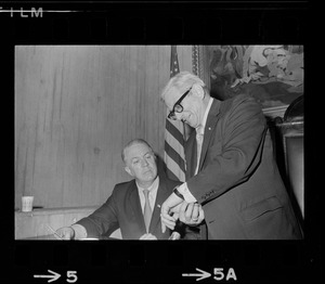 Councilor O'Neil is reminded of lateness by Councilor Piemonte as they left City Hall at 5:35 a. m.