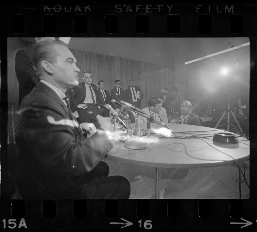 Former Alabama Gov. George Wallace addresses newsmen at Logan Airport during unexpected visit to Hub